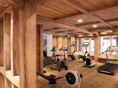 a gym with several exercise equipment in a room at Résidence Les Fermes du Soleil - maeva Home - Appartement 3 pièces 6 personnes Sélection MAE-1439 in Les Carroz d'Araches