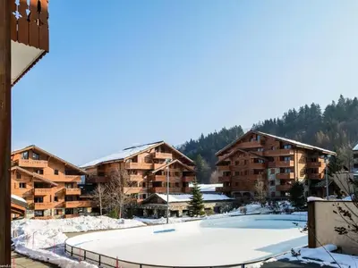 a view of a ski resort with snow covered buildings at Résidence Les Fermes du Soleil - maeva Home - Appartement 3 pièces 6 personnes Sélection MAE-1439 in Les Carroz d'Araches
