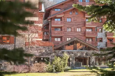 a large wooden building with balconies on it at Résidence Les Fermes du Soleil - maeva Home - 3 pièces 6 pers Sélection MAE-5543 in Les Carroz d'Araches