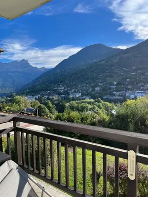 a bathroom with a shower in a stone wall at Appartement cosy, esprit chalet avec jolie vue in Saint-Gervais-les-Bains