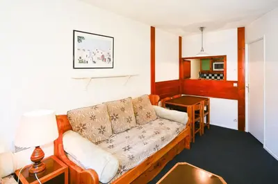 a living room with a couch and a table at L'Aiguille - maeva Home - 2 Pièces 5 Personnes - Sélection MAE-4175 in Chamonix-Mont-Blanc