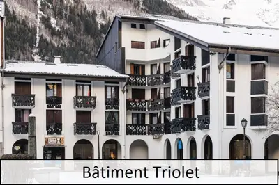 a building with balconies and the words parliament district at L'Aiguille - maeva Home - 2 Pièces 5 Personnes - Sélection MAE-4175 in Chamonix-Mont-Blanc