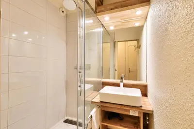 a bathroom with a sink and a shower at L'Aiguille - maeva Home - 2 Pièces 5 Personnes Sélection MAE-1179 in Chamonix-Mont-Blanc