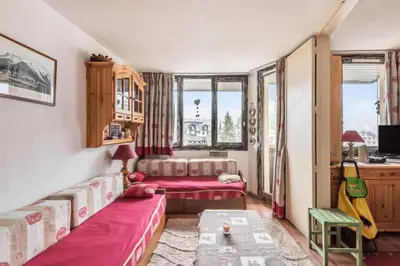 a living room with two beds and a table at L'Aiguille - maeva Home - Appartement 2 pièces 5 personnes Confort MAE-2592 in Chamonix-Mont-Blanc