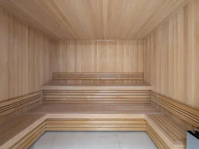 an empty sauna with wooden walls and wooden floors at Superbe appartement avec jardin à Megève, 3 chambres, animaux acceptés - FR-1-569-118 in Megève