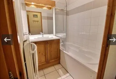 a bathroom with a tub and a sink and a bath tub at Residence le Grand Panorama - with garden & view in Saint-Gervais-les-Bains