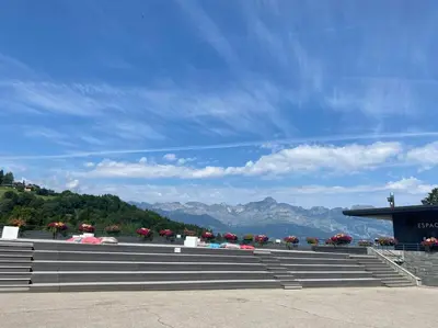 a group of bleachers with mountains in the background at Residence le Grand Panorama - with garden & view in Saint-Gervais-les-Bains