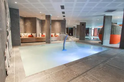 a bathroom with a shower and a sink and a toilet at Belambra Clubs Flaine Panorama in Flaine