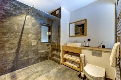 a bathroom with a shower and a sink at Chalet Silver Forest in Chamonix-Mont-Blanc