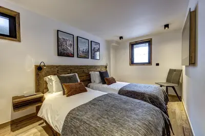 two beds in a hotel room with two beds at Chalet Silver Forest in Chamonix-Mont-Blanc