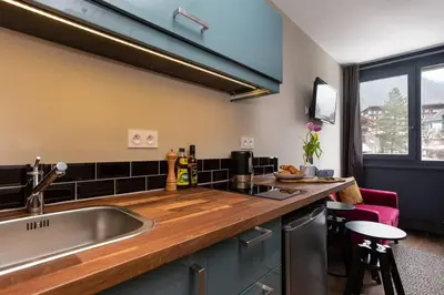 a kitchen with a sink and a counter top at Beautiful cosy, modern studio in Chamonix centre in Chamonix-Mont-Blanc