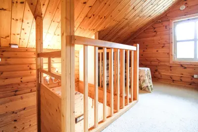 a log cabin with a staircase in a room at Charming 4-bed Chalet, Mountain Views, Double Garage in Flaine
