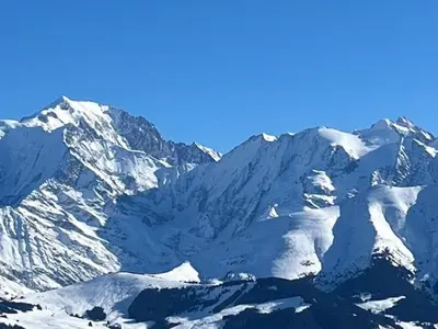 a snow covered mountain range with snow on it at LE GL'ASSIE in Saint-Gervais-les-Bains