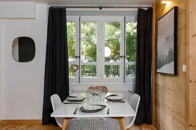 a living room with a couch and a table at Le Refuge du Lyret - 2 Pers - Rénové in Chamonix-Mont-Blanc