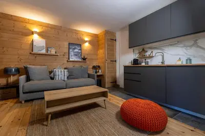 a kitchen with a white table and chairs and a window at Le Refuge du Lyret - 2 Pers - Rénové in Chamonix-Mont-Blanc