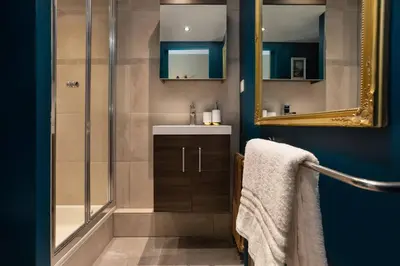 a bathroom with a shower and a sink and a mirror at Modern apartment with the best Mont Blanc view! in Chamonix-Mont-Blanc