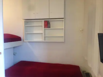 a room with a book shelf and a cabinet at Appartment Aiguille Du Midi in Chamonix-Mont-Blanc