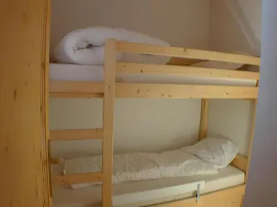 a couple of bunk beds in a room at Duplex T4 calme avec parking, animaux acceptés à Samoëns - FR-1-629-133 in Samoëns
