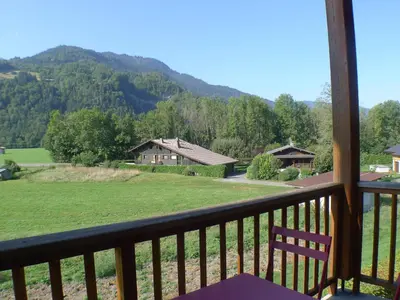 a balcony with a view of a mountain at Duplex T4 calme avec parking, animaux acceptés à Samoëns - FR-1-629-133 in Samoëns