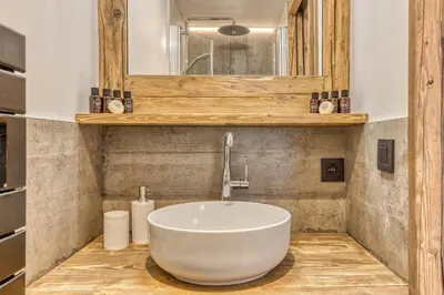 a bedroom with a large bed and a window at Chalet BelleVue in Chamonix-Mont-Blanc