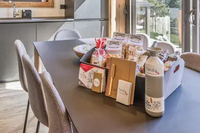 a table with food and a bottle of milk on it at Chalet BelleVue in Chamonix-Mont-Blanc