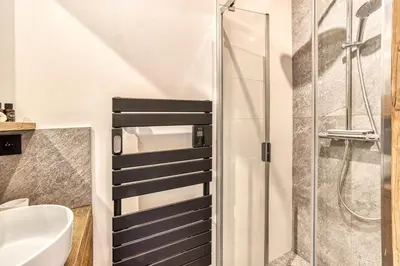 a bathroom with a shower and a sink at Chalet BelleVue in Chamonix-Mont-Blanc