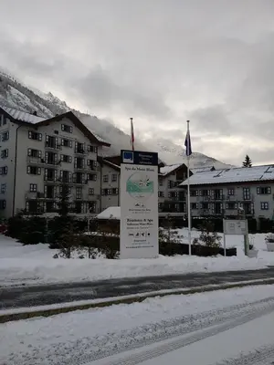 a sign in the snow in front of a resort at Duplex résidence spa Mont-Blanc in Vallorcine