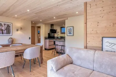 a living room with a couch and a table at Appartement Chablis - Welkeys in Combloux