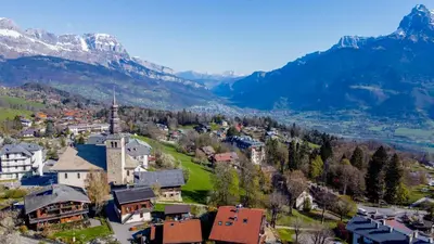 an aerial view of a small town in the mountains at Studio rénové avec terrasse Sud idéalement situé in Combloux