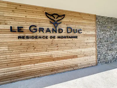 a sign on the side of a building at GRD005 - Appartement standing 6 pers pied de piste in Les Carroz d'Araches
