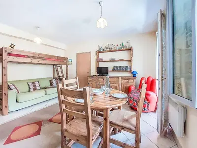 a bedroom with a large bed with a table on it at Apartment Central résidence 3 by Interhome in Saint-Gervais-les-Bains