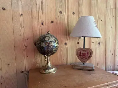a table with a lamp and a heart on it at Appartement sud vue pistes, terrasse, équipement complet, sans animaux - FR-1-642-84 in Morillon