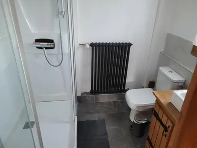 a small bathroom with a toilet and a radiator at Bethel-Mont-Blanc in Saint-Gervais-les-Bains
