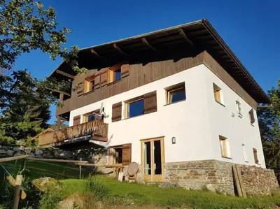 a large white house with a balcony at Bethel-Mont-Blanc in Saint-Gervais-les-Bains