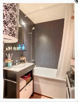 a bathroom with a sink and a bath tub at Appartement montagnard avec vue sur le Mont-Blanc in Saint-Gervais-les-Bains