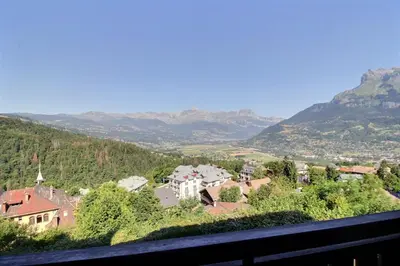 a view of a town in a valley with mountains at Studio coin nuit style chalet in Saint-Gervais-les-Bains