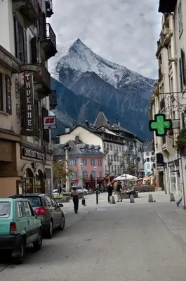 a large building in front of a mountain at Apartment Bonatti 202 in Chamonix-Mont-Blanc