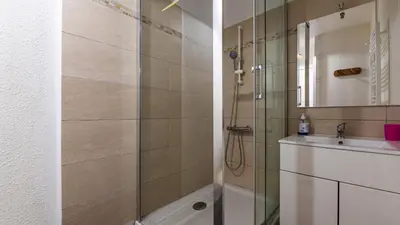 a bathroom with a shower and a sink at Grande Neige 23 - Appt pied des pistes 4 pers in Morillon