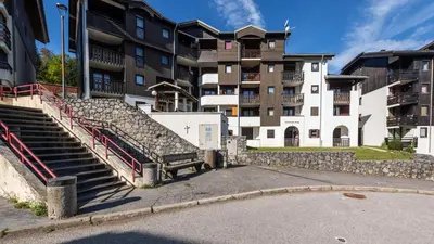 a group of stairs in front of a building at Grande Neige 23 - Appt pied des pistes 4 pers in Morillon