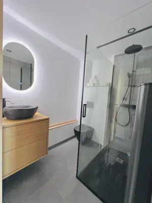 a bathroom with a sink and a mirror at Appartement 4 personnes pistes in Combloux