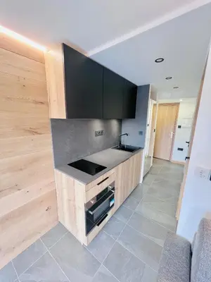 a kitchen with a sink and a counter top at Appartement 4 personnes pistes in Combloux