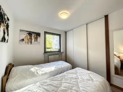 a bedroom with two beds and a window at Appartement au centre de Chamonix - 6 pers, parking, confort 3 étoiles - FR-1-507-74 in Chamonix-Mont-Blanc