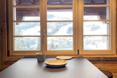 two bowls on a table in front of a window at Megeve cosy appartement Bianca centre in Megève
