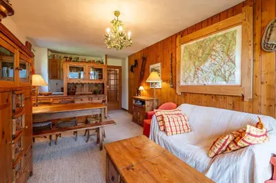 a living room with a couch and a table at SmartStay Mummery - Chamonix in Chamonix-Mont-Blanc