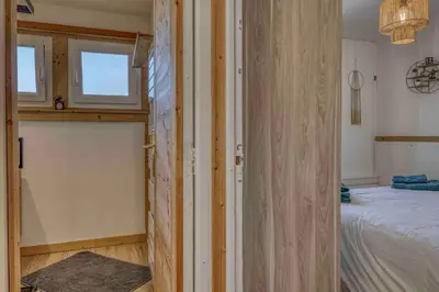 a small bedroom with a bed and a window at chalet Relax située a 25km de Chamonix in Saint-Gervais-les-Bains