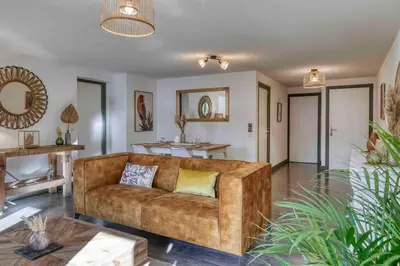 a living room with a couch and a table at Appartement «Chez Paulette»situé à 25Km chamonix  in Saint-Gervais-les-Bains