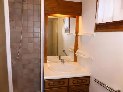 a bathroom with a sink and a mirror at Résidence Les Trolles - Trolles 5A MAE-7374 in Les Contamines-Montjoie