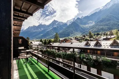 a balcony with a view of the mountains at Les Marmottes - Renovated and cozy apart - View of the mountains in Les Houches