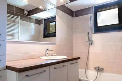 a bathroom with a sink and a shower at Les Marmottes - Renovated and cozy apart - View of the mountains in Les Houches
