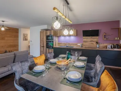 a dining room with a table and chairs at Appartement moderne 3 chambres à Megève avec garage - FR-1-569-131 in Megève